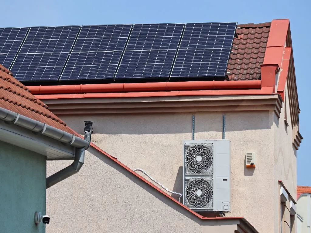 The solar-powered home has air conditioning units.