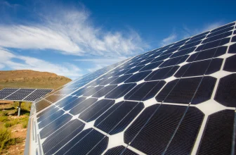 Photovoltaic solar panels generating renewable energy installed on the field.